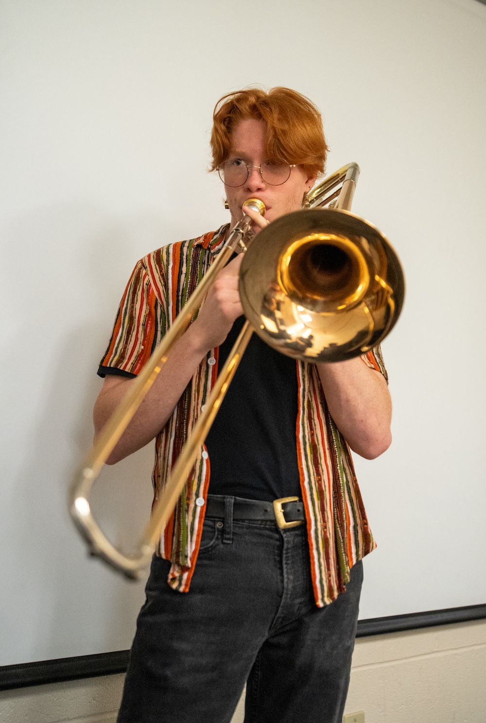 A music student practices trombone.